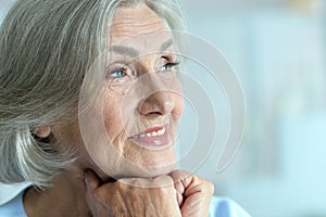 Portrait of happy beautiful senior woman posing