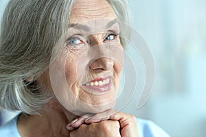 Portrait of happy beautiful senior woman posing