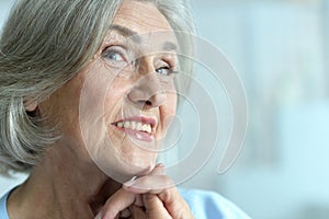 Portrait of happy beautiful senior woman posing