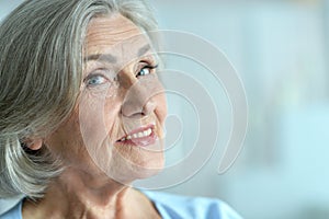 Portrait of happy beautiful senior woman posing