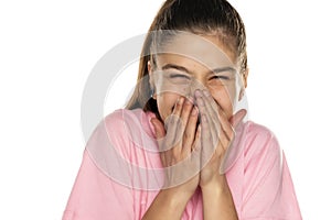 Portrait of happy beautiful woman covering her mouth with her hands