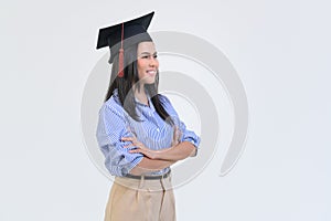 Portrait of happy Beautiful woman in graduation gown over white background