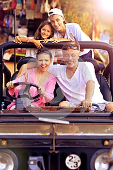 Portrait of happy big happy family in car