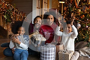 Portrait of happy biracial family celebrate Christmas at home