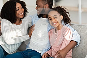 Portrait of happy black family spending time together