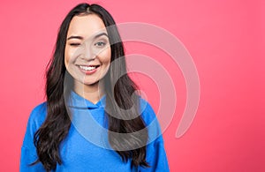 Portrait of a happy blinking Asian girl