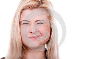 Portrait of happy blonde, charming winking woman