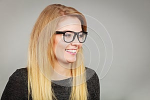 Portrait of happy blonde woman smiling with joy