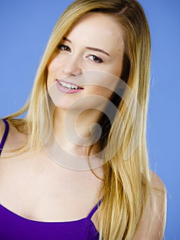 Portrait of happy blonde woman smiling with joy