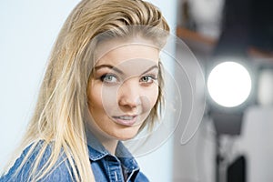 Portrait of happy blonde woman smiling with joy