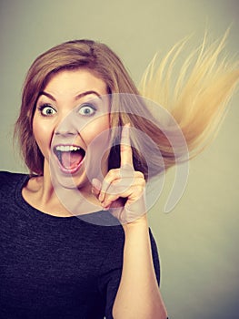 Portrait of happy blonde woman smiling with joy