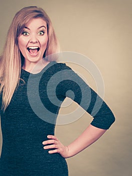 Portrait of happy blonde woman smiling with joy