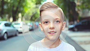 Portrait of happy boy with cool hipster haircut - Charming young casual smiling kid with trendy hairstyle