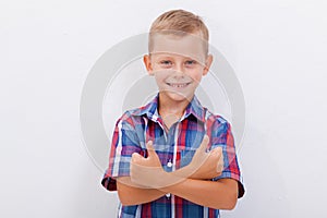 Portrait of happy boy showing thumbs up gesture