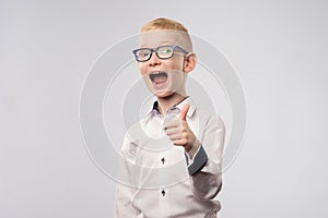 Portrait of happy boy showing thumbs up gesture