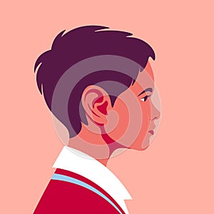 Portrait of a happy brunette boy. The child`s face in profile. Avatar of a schoolboy. Side view.