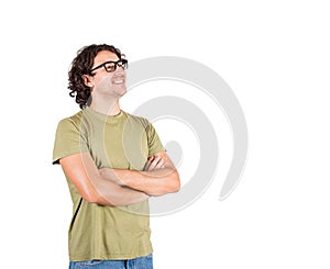 Portrait of happy brunette young man, long curly hair wears glasses, keeps arms folded looking confident aside isolated on white