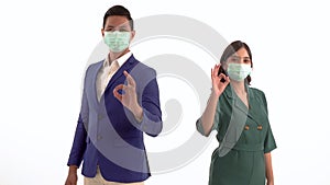 Portrait of a happy business partner Showing thumbs with masks