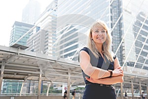 Portrait of happy business woman looking confident. People and lifestyles concept. Outdoors theme