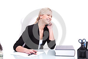 Portrait of happy business woman sitting on her desk.