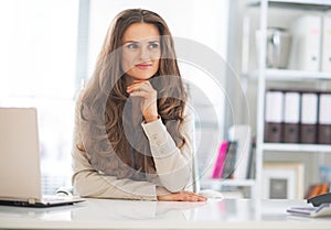 Portrait of happy business woman at work