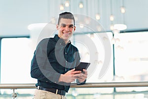 Portrait of happy businessman in office building