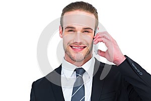 Portrait of a happy businessman phoning