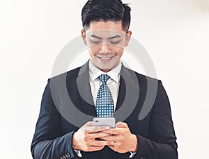 Portrait of  happy  businessman using mobile phone