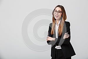 Portrait of a happy businesswoman dressed in suit