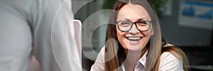 Cheerful woman in modern office photo