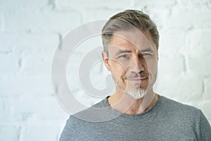 Portrait of happy casual middle aged man smiling