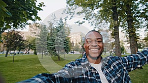 Portrait happy cheerful carefree african american man young enthusiastic exited guy student teenager male holding camera