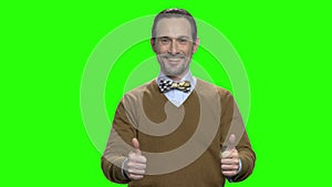 Portrait of happy cheerful smiling man shows two thumbs up.