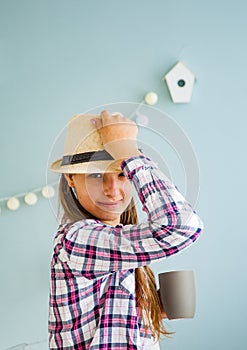 Portrait of happy, cheerful teenage girl in a hat