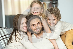 Portrait of happy cheerful young family with kids bonding togeth