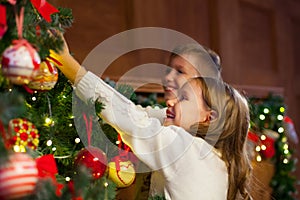 Portrait of happy children decorating Christmas tree.Family, chr