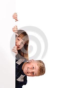 Portrait of happy children with white blank