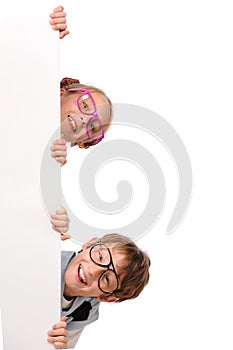 Portrait of happy children with white blank