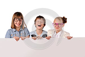 Portrait of happy children with white blank