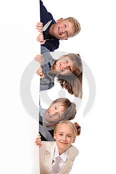 Portrait of happy children with white blank