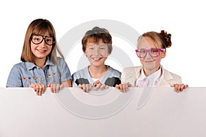Portrait of happy children with white blank