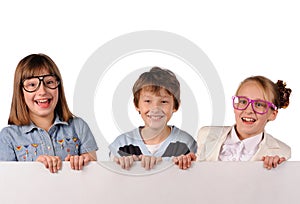 Portrait of happy children with white blank