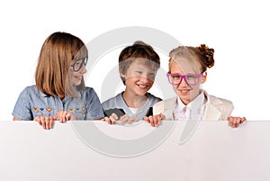 Portrait of happy children with white blank