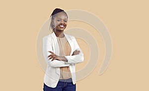 Portrait of happy confident black businesswoman isolated on beige copy space background