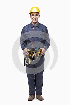 Portrait of Happy Construction Worker with Tool Belt, Studio Shot