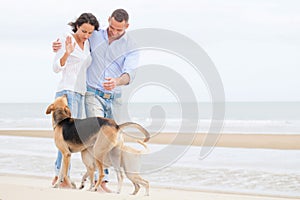 Portrait of a happy couple with dogs