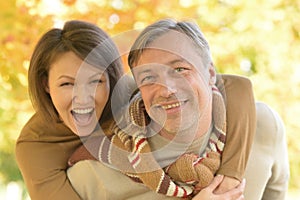 Portrait of happy couple posing in park