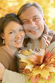 Portrait of happy couple posing in park