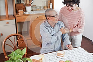 Portrait of happy couple senior asia woman and retirement man having breakfast together