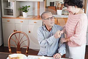 Portrait of happy couple senior asia woman and retirement man having breakfast together